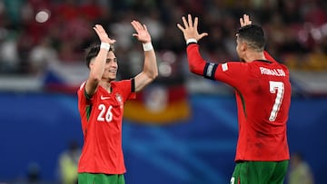Portugal's forward #07 Cristiano Ronaldo and second goal-scorer, Portugal's forward #26 Francisco Conceicao celebrate on the pitch after the UEFA Euro 2024 Group F football match between Portugal and the Czech Republic at the Leipzig Stadium in Leipzig on June 18, 2024. (Photo by PATRICIA DE MELO MOREIRA / AFP)