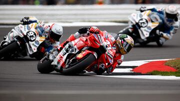 Ducati Lenovo Team's Italian rider Enea Bastianini (C) competes during the MotoGP race of British Grand Prix at Silverstone circuit in Northamptonshire, central England, on August 4, 2024. (Photo by BENJAMIN CREMEL / AFP)