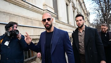 (FILES) Andrew Tate (L) and Tristan Tate (R) walk from the Bucharest's Court of Appeal after a hearing about their demand to be allowed to leave Romania as their mother allegedly suffered a heart attack, in Bucharest, on December 22, 2023. Controversial influencer Andrew Tate and his brother have been arrested in Romania over UK sex offence charges, police said on March 12, 2024. Police said in a statement it executed "two European arrest warrants issued by the UK judicial authorities for the committing of sexual offences, of exploitation of persons on the territory of the UK". (Photo by Daniel MIHAILESCU / AFP)