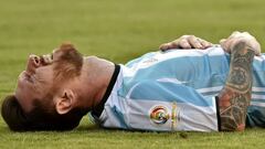 Argentina's Lionel Messi lying on the field during Copa America