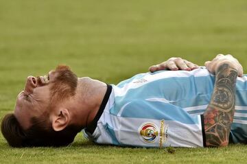 Argentina's Lionel Messi lying on the field during Copa America