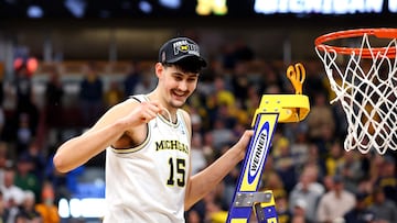 Aday Mara #15 of the Michigan Wolverines cuts down the nets after the game against the Tennessee Volunteers in the Elite Eight of the 2026 NCAA Men's Basketball Tournament at the United Center on March 29, 2026 in Chicago, Illinois.