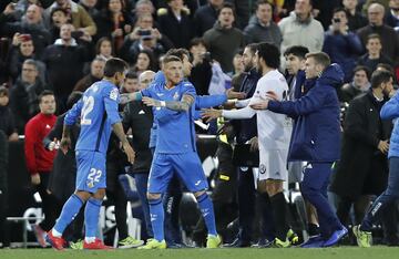 Valencia and Getafe players were involved in a brawl at the end of their Copa del Rey match that saw Valencia score twice in 45 seconds to go through.