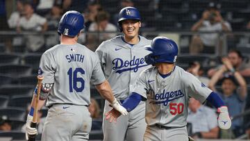Jun 8, 2024; Bronx, New York, USA; Los Angeles Dodgers designated hitter Shohei Ohtani (17) and catcher Will Smith (16) and shortstop Mookie Betts (50) celebrate during the ninth inning against the New York Yankees at Yankee Stadium. Mandatory Credit: Vincent Carchietta-USA TODAY Sports