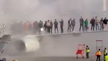 New footage revealed: passengers escape onto wing as American Airlines plane burns in Denver