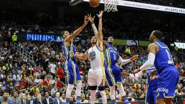 Mar 6, 2017; Atlanta, GA, USA; Golden State Warriors guard Stephen Curry (30) goes up for a rebound with Atlanta Hawks forward Thabo Sefolosha (25) and guard Dennis Schroder (17) in the first quarter at Philips Arena. Mandatory Credit: Brett Davis-USA TODAY Sports