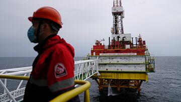 FILE PHOTO: An employee is seen at an oil platform operated by Lukoil company at the Kravtsovskoye oilfield in the Baltic Sea, Russia September 16, 2021. REUTERS/Vitaly Nevar/File Photo