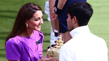 Kate Middleton, the Princess of Wales, presents Carlos Alcaraz with the Wimbledon trophy in July.