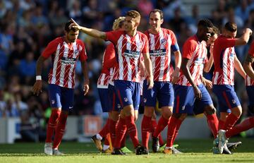 Lucas Hernández (centre) celebrates his winning goal after Steve Sidwell had levelled for Brighton.