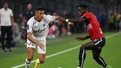 Marseille's Chilean forward Alexis Sanchez (L) fights for the ball with Lille's French midfielder Jonathan Bamba during the French L1 football match between Olympique Marseille (OM) and Lille LOSC at Stade Velodrome in Marseille, southern France on September 10, 2022. (Photo by Christophe SIMON / AFP) (Photo by CHRISTOPHE SIMON/AFP via Getty Images)