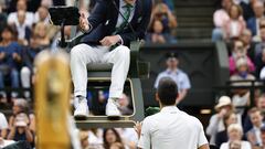 Novak Djokovic argues with the umpire during his Men's Singles semi-final match against Jannik Sinnner.