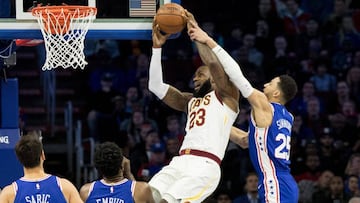 Nov 27, 2017; Philadelphia, PA, USA; Cleveland Cavaliers forward LeBron James (23) attempts a shot while fouled by Philadelphia 76ers guard Ben Simmons (25) during the first quarter at Wells Fargo Center. Mandatory Credit: Bill Streicher-USA TODAY Sports
