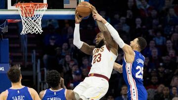 Nov 27, 2017; Philadelphia, PA, USA; Cleveland Cavaliers forward LeBron James (23) attempts a shot while fouled by Philadelphia 76ers guard Ben Simmons (25) during the first quarter at Wells Fargo Center. Mandatory Credit: Bill Streicher-USA TODAY Sports