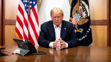 HANDOUT - 04 October 2020, US, Bethesda: US&nbsp;President Donald Trump, joined by Chief of Staff Mark Meadows, participates in a phone call with Vice President Mike Pence, Secretary of Defence Mark Esper, Secretary of State Mike Pompeo, Chairman of the J