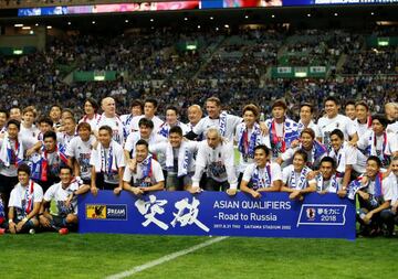 Japan's players celebrate qualifying for the World Cup.