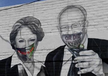 A mural on the side of the Majestic Repertory Theater depicts Las Vegas Mayor Carolyn Goodman and her husband, former Las Vegas Mayor Oscar Goodman, with masks added over their faces in the downtown Arts District amid the spread of the coronavirus on 17 M