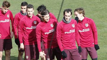 Godín y Filipe, encabezando un entrenamiento del Atlético.