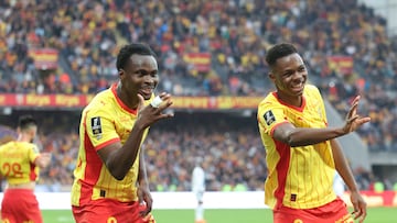 Lens' Austrian defender #06 Samson Baidoo (L) celebrates with Lens' Malian midfielder #08 Mamadou Sangare after scoring a goal during the French L1 football match between RC Lens and Paris FC at the Stade Bollaert-Delelis in Lens, northern France, on October 19, 2025. (Photo by Francois LO PRESTI / AFP)
