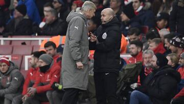 Arsenal manager Arsene Wenger clashes with fourth official Anthony Taylor before being sent to the stands