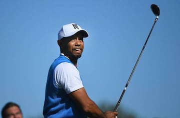 This file photo taken on January 25, 2017 shows Tiger Woods playing his shot from the second tee during the first round of the Farmers Insurance Open at Torrey Pines South in San Diego, California.