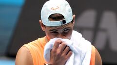 Spain's Rafael Nadal wapes his face during a training session at Melbourne Park on February 7, 2021, in preparation for the Australian Open. (Photo by David Gray / AFP) / ---IMAGE RESTRICTED TO EDITORIAL USE - STRICTLY NO COMMERCIAL USE---