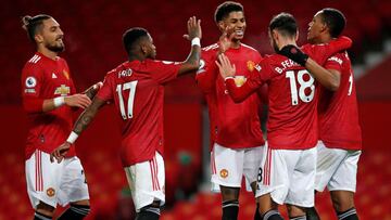 Manchester United's Portuguese midfielder Bruno Fernandes (2nd R) celebrates with teammates after scoring their sixth goal from the penalty spot during the English Premier League football match between Manchester United and Leeds United at Old Traffo