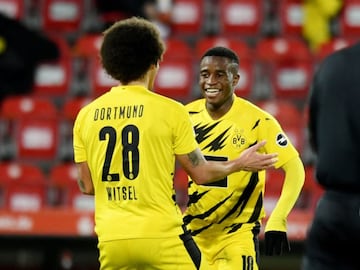 Borussia Dortmund's Youssoufa Moukoko celebrates scoring their first goal with Axel Witsel.