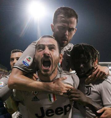 Soccer Football - Serie A - Cagliari v Juventus - Sardegna Arena, Cagliari, Italy - April 2, 2019 Juventus' Leonardo Bonucci celebrates scoring their first goal with Miralem Pjanic and Moise Kean