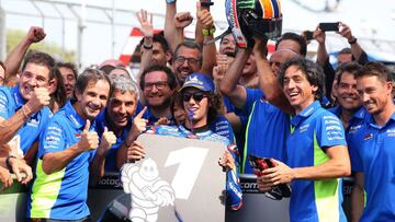 Northampton (United Kingdom), 25/08/2019.- Spanish MotoGP rider Alex Rins of the Suzuki Ecstar Team celebrates victory in parc Fermé with his team during the MotoGP race of the 2019 Motorcycling Grand Prix of Britain at the Silverstone race track,
