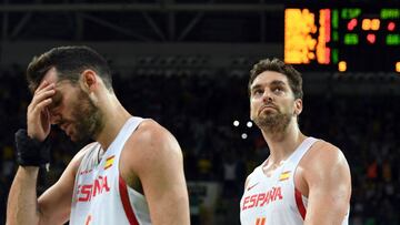 Spain's small forward Rudy Fernandez (L) and Spain's centre Pau Gasol leave the court after Brazil defeated Spain during a Men's round Group B basketball match between Spain and Brazil at the Carioca Arena 1 in Rio de Janeiro on August 9, 2016 during the Rio 2016 Olympic Games. / AFP PHOTO / Mark RALSTON