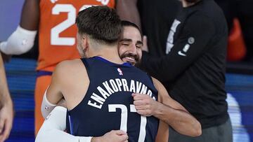 Aug 2, 2020; Lake Buena Vista, USA; Dallas Mavericks guard Luka Doncic (77) embraces Phoenix Suns guard Ricky Rubio (11) after playing in an NBA basketball game Sunday, Aug. 2, 2020, in Lake Buena Vista, Fla. Phoenix won 117-115. Mandatory Credit: Ashley Landis/Pool Photo via USA TODAY Sports