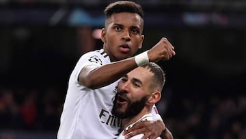 Real Madrid&#039;s French forward Karim Benzema (R) celebrates with Real Madrid&#039;s Brazilian forward Rodrygo after scoring during the UEFA Champions League Group A football match between Real Madrid and Galatasaray at the Santiago Bernabeu stadium in 