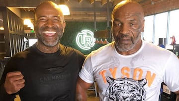 Mike Tyson, con su entrenador Rafael Cordeiro.