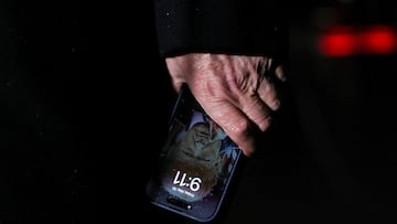 U.S. President Donald Trump holds a mobile phone with his image on it, after his return from Pennsylvania, at Joint Base Andrews, Maryland, U.S., May 30, 2025. REUTERS/Leah Millis REFILE - CORRECTING LOCATION FROM "WASHINGTON, D.C." TO "JOINT BASE ANDREWS, MARYLAND".