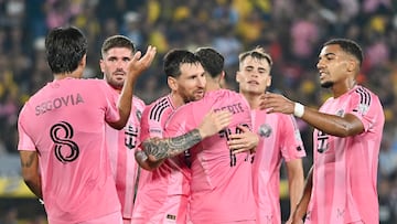 TOPSHOT - Inter Miami's Argentine forward #10 Lionel Messi (C-L) celebrates scoring his team's first goal during the friendly football match between Ecuador's Barcelona and the US' Inter Miami at the Banco Pichincha Stadium in Guayaquil, Ecuador, on February 7, 2026. (Photo by Marcos PIN / AFP)