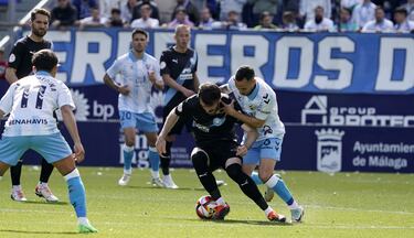 Aprobados y suspensos del M¨¢laga: gol de Dioni en una Rosaleda de r¨¦cord