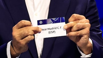 Italy's former goalkeeper Gianluigi Buffon shows the paper slip of Real Madrid CF (ESP) during the group stage of the 2024-2025 UEFA Champions League football tournament, at the Grimaldi Forum in Monaco on August 29, 2024. (Photo by Valery HACHE / AFP)