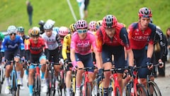 Overall leader INEOS Grenadiers's British rider Geraint Thomas (C) and fellow riders of the pack cycle during the thirteenth stage of the Giro d'Italia 2023 cycling race, which start was transfered from Borgofranco d'Ivrea to Le Chable due to bad weather conditions, and Crans-Montana, on May 19, 2023. (Photo by Luca Bettini / AFP)
