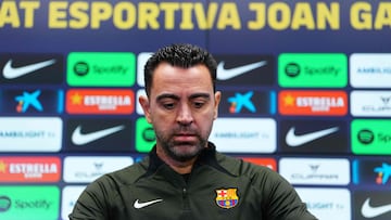 Barcelona's Spanish coach Xavi addresses a press conference at the Joan Gamper training ground in Sant Joan Despi, near Barcelona, on January 30, 2024. Only a few months after lifting the Spanish title, Barcelona coach Xavi Hernandez dramatically announced he would walk away from the club at the end of the season. After Villarreal stunned Barcelona on January 28 with a 5-3 win which left the champions third, and 10 points behind La Liga leaders Real Madrid, Xavi said he was stepping down in June. (Photo by PAU BARRENA / AFP)