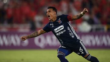 Independiente Medellin's David Loaiza celebrates after scoring in a penalty shoot-out at the end of the Sudamericana Cup first round second leg all-Colombian football match between America de Cali and Independiente Medellin, at the Pascual Guerrero stadium in Cali, Colombia, on March 16, 2022. (Photo by Luis ROBAYO / AFP)