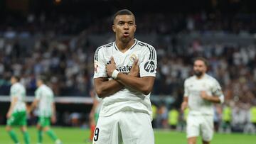 Real Madrid's French forward #09 Kylian Mbappe celebrates scoring his team's second goal during the Spanish league football match between Real Real Madrid CF and Real Betis at the Santiago Bernabeu stadium in Madrid on September 1, 2024. (Photo by Thomas COEX / AFP)