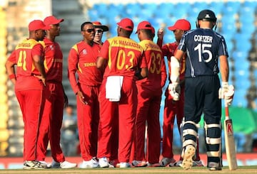 Zimbabwe's Wellington Masakadza (third left) celebrates with his team-mates after the dismissal of Scotland batsman George Munsey.