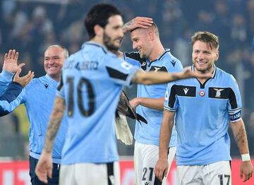 Ciro Immobile and Sergej Milinkovic-Savic celebrate victory over Inter Milan.