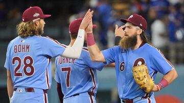 Philadelphia rallied with timely hitting and key Dodgers errors to secure an 8-2 victory, keeping their NLDS hopes alive.