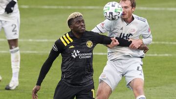 Dec 6, 2020; Columbus, Ohio, USA; New England Revolution heads the ball away from Columbus Crew SC forward Gyasi Zardes (11) in the first half at MAPFRE Stadium. Mandatory Credit: Greg Bartram-USA TODAY Sports