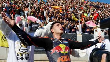 Kalex Red Bull KTM Ajo Spanish rider Augusto Fernandez celebrates as he won the World Championship after the Moto2 Valencia MotoGP race at the Ricardo Tormo racetrack in Cheste, near Valencia, on November 6, 2022. (Photo by JOSE JORDAN / AFP) (Photo by JOSE JORDAN/AFP via Getty Images)