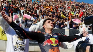 Kalex Red Bull KTM Ajo Spanish rider Augusto Fernandez celebrates as he won the World Championship after the Moto2 Valencia MotoGP race at the Ricardo Tormo racetrack in Cheste, near Valencia, on November 6, 2022. (Photo by JOSE JORDAN / AFP) (Photo by JOSE JORDAN/AFP via Getty Images)