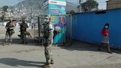 Soldiers keep watch in Cantagallo, an indigenous Shipibo-Conibo community, during the vaccination campaign against the coronavirus disease (COVID-19), in Lima, Peru February 19, 2021. REUTERS/Angela Ponce