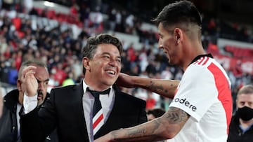 River Plate's coach Marcelo Gallardo (L) celebrates with defender Fabrizio Angileri after defeating Boca Juniors 2-1 in their Argentine Professional Football League match match at the Monumental stadium in Buenos Aires, on October 3, 2021. (Photo by Alejandro PAGNI / AFP)