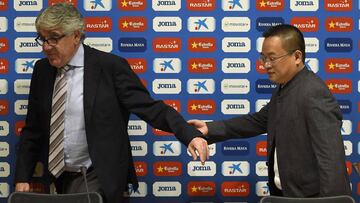 Chairman of Rastar Group and new president of Spanish football team RCD Espanyol, Chinese tycoon Chen Yansheng (R) and former RCD Espanyol's president Daniel Sanchez Llibre arrive to give a press conference on January 21, 2016 at Cornella-El Prat sta